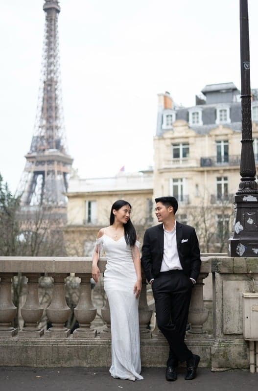 Suthida and Thanapat together near the Eiffel Tower